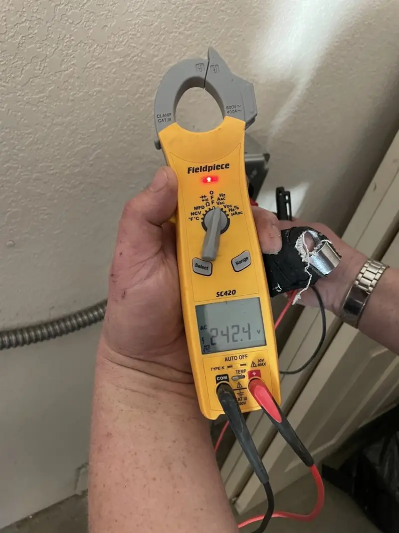 Voltage testing with clamp meter during Electrical Installation Services in Floresville